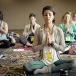 group of people doing yoga